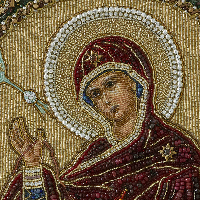The embroidered icon of the Annunciation. The Virgin" in a frame