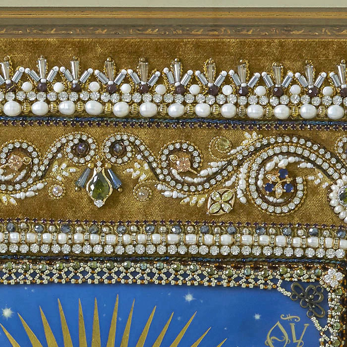 The embroidered icon "Our Lady of Ostrobram" in a frame