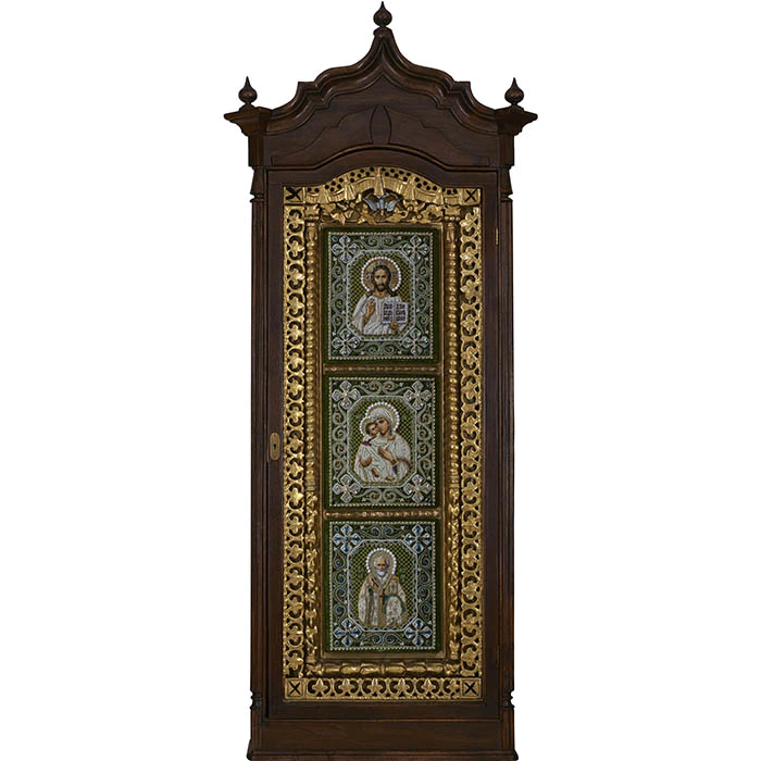 The embroidered triptych icon "The Lord Almighty. Our Lady of Vladimir. St. Nicholas the Wonderworker"" in an antique frame and a kiosk