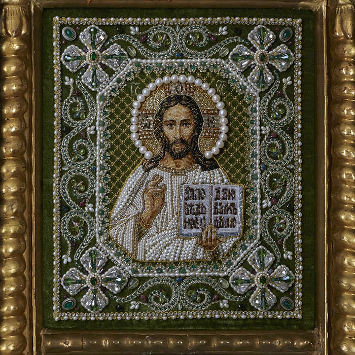 The embroidered triptych icon "The Lord Almighty. Our Lady of Vladimir. St. Nicholas the Wonderworker"" in an antique frame and a kiosk