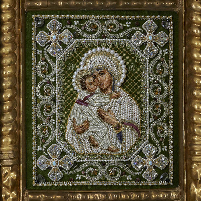 The embroidered triptych icon "The Lord Almighty. Our Lady of Vladimir. St. Nicholas the Wonderworker"" in an antique frame and a kiosk