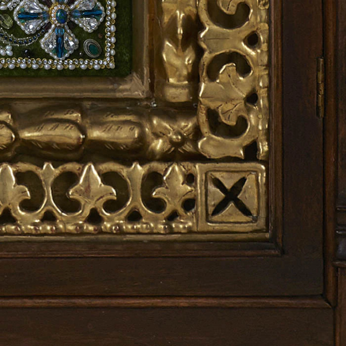 The embroidered triptych icon "The Lord Almighty. Our Lady of Vladimir. St. Nicholas the Wonderworker"" in an antique frame and a kiosk