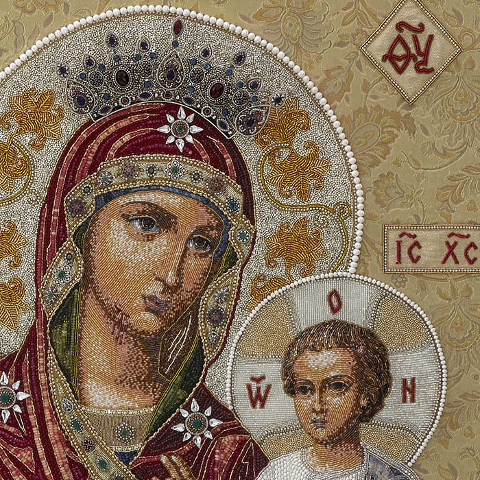 Embroidered icon of Our Lady of Iveria in a frame and a kiosk