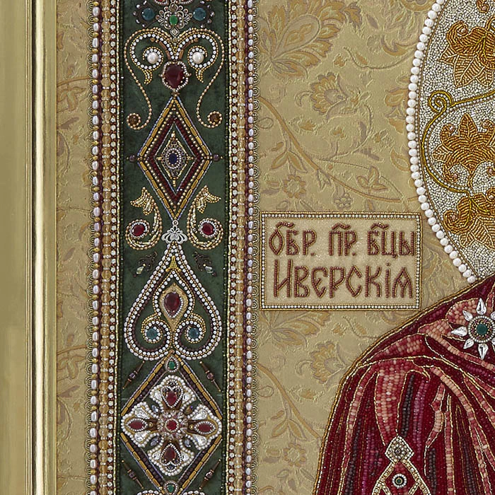 Embroidered icon of Our Lady of Iveria in a frame and a kiosk