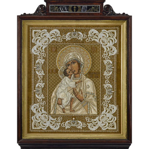The embroidered icon "Our Lady of Feodorovskaya" in a frame and a kiosk