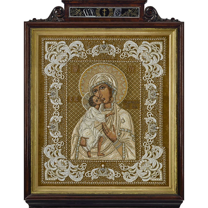 The embroidered icon "Our Lady of Feodorovskaya" in a frame and a kiosk