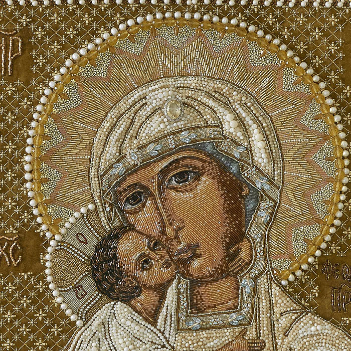 The embroidered icon "Our Lady of Feodorovskaya" in a frame and a kiosk