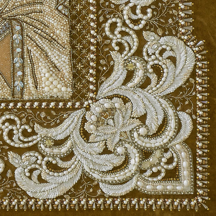 The embroidered icon "Our Lady of Feodorovskaya" in a frame and a kiosk