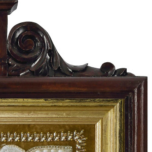 The embroidered icon "Our Lady of Feodorovskaya" in a frame and a kiosk