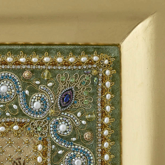 The embroidered icon "Our Lady of Unfading Color" in a frame and antique case
