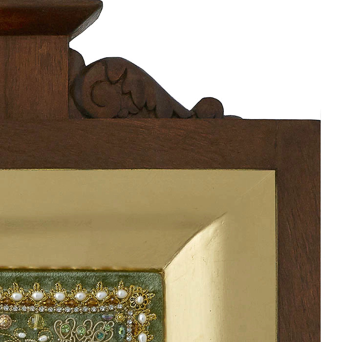 The embroidered icon "Our Lady of Unfading Color" in a frame and antique case