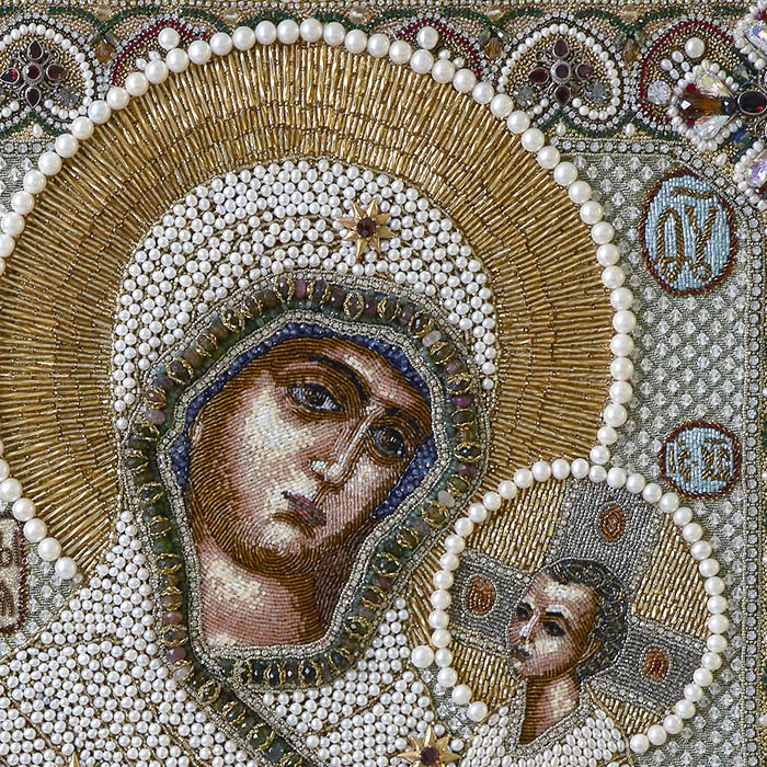 The embroidered icon of Our Lady of Odigitria in a frame and antique case