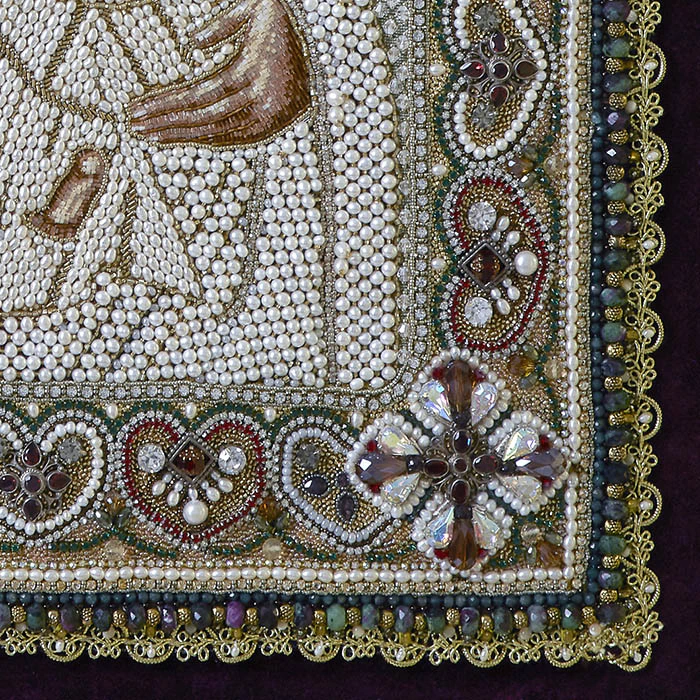 The embroidered icon of Our Lady of Odigitria in a frame and antique case