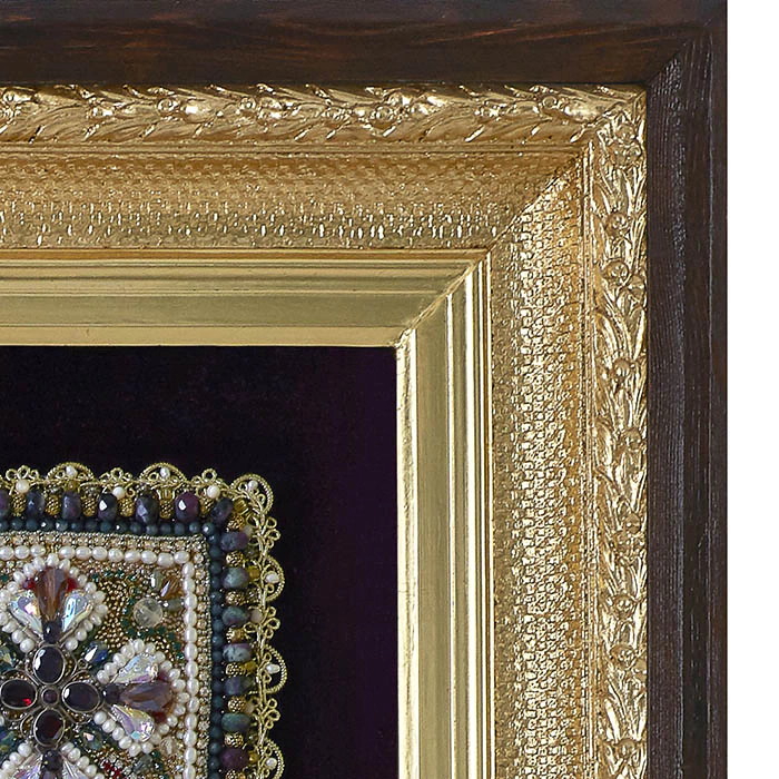 The embroidered icon of Our Lady of Odigitria in a frame and antique case