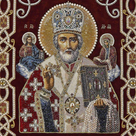 Embroidered icon of St. Nicholas the Wonderworker in a frame and a kiosk