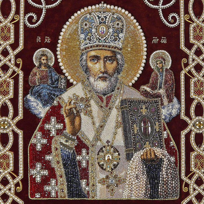 Embroidered icon of St. Nicholas the Wonderworker in a frame and a kiosk