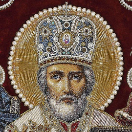 Embroidered icon of St. Nicholas the Wonderworker in a frame and a kiosk