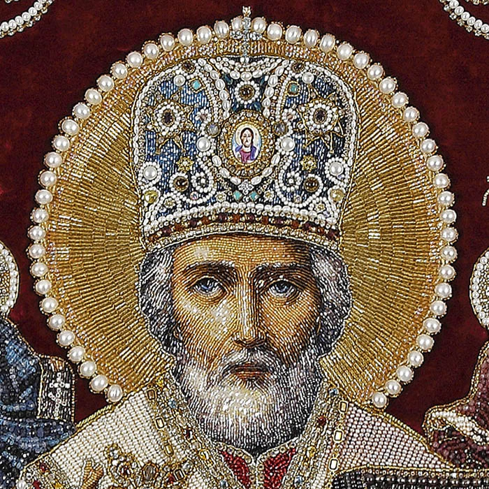 Embroidered icon of St. Nicholas the Wonderworker in a frame and a kiosk