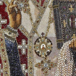 Embroidered icon of St. Nicholas the Wonderworker in a frame and a kiosk