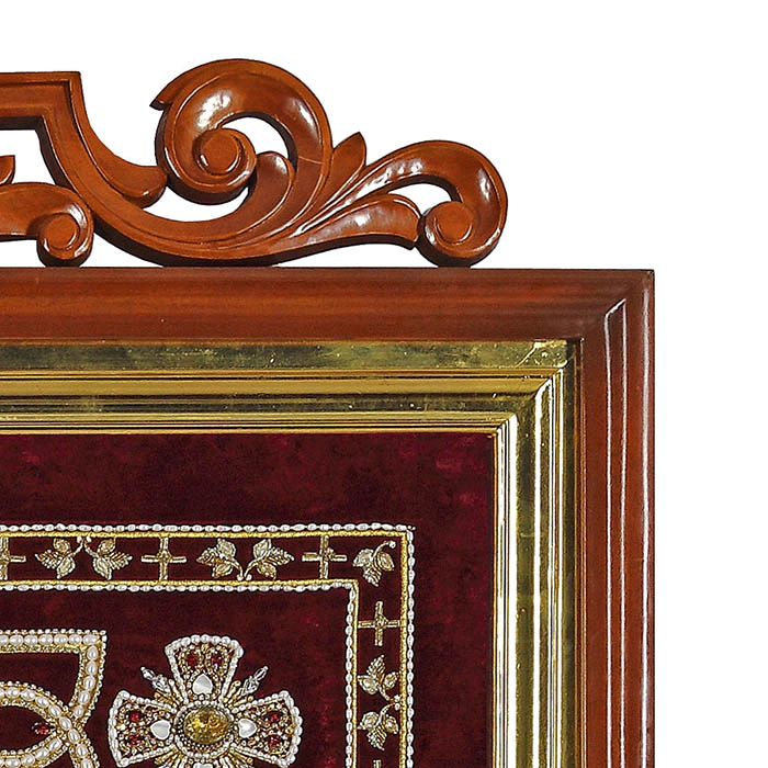 Embroidered icon of St. Nicholas the Wonderworker in a frame and a kiosk