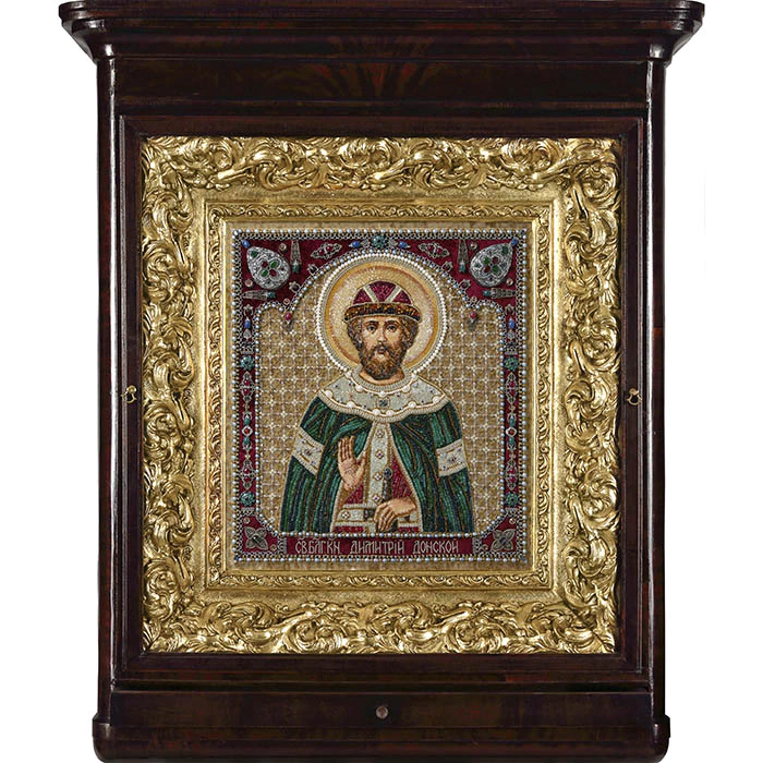 The embroidered icon "Blessed Prince Dimitri Donskoy" in an antique frame and a kiosk