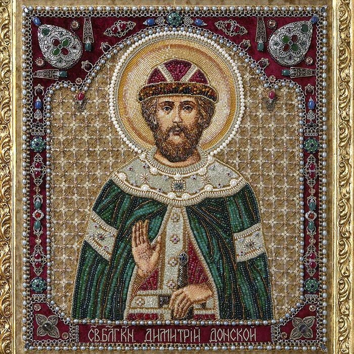 The embroidered icon "Blessed Prince Dimitri Donskoy" in an antique frame and a kiosk