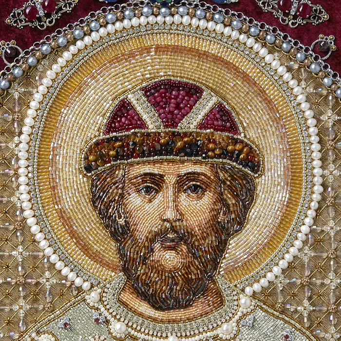 The embroidered icon "Blessed Prince Dimitri Donskoy" in an antique frame and a kiosk