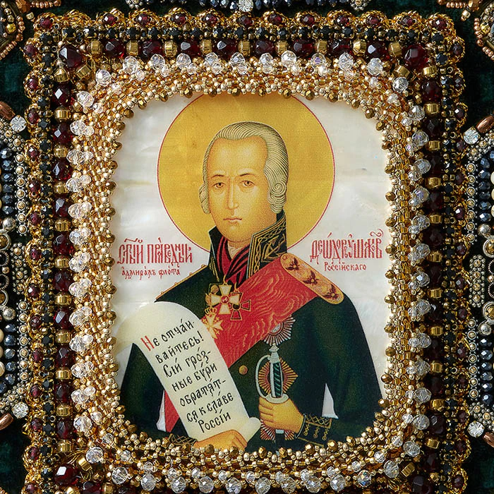 The embroidered icon "The Righteous Warrior Feodor Ushakov" in a frame and a case