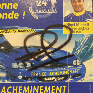 An autographed card of racing driver Nigel Mansell