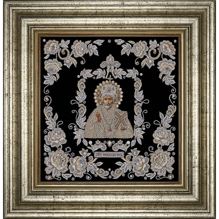 The embroidered icon of St. Nicholas the Wonderworker in a frame