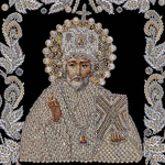 The embroidered icon of St. Nicholas the Wonderworker in a frame