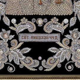 The embroidered icon of St. Nicholas the Wonderworker in a frame