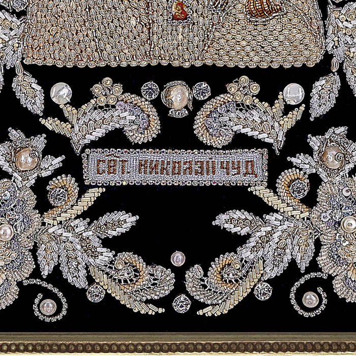 The embroidered icon of St. Nicholas the Wonderworker in a frame