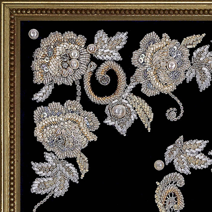 The embroidered icon of St. Nicholas the Wonderworker in a frame