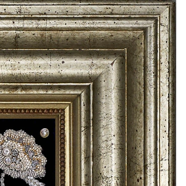 The embroidered icon of St. Nicholas the Wonderworker in a frame