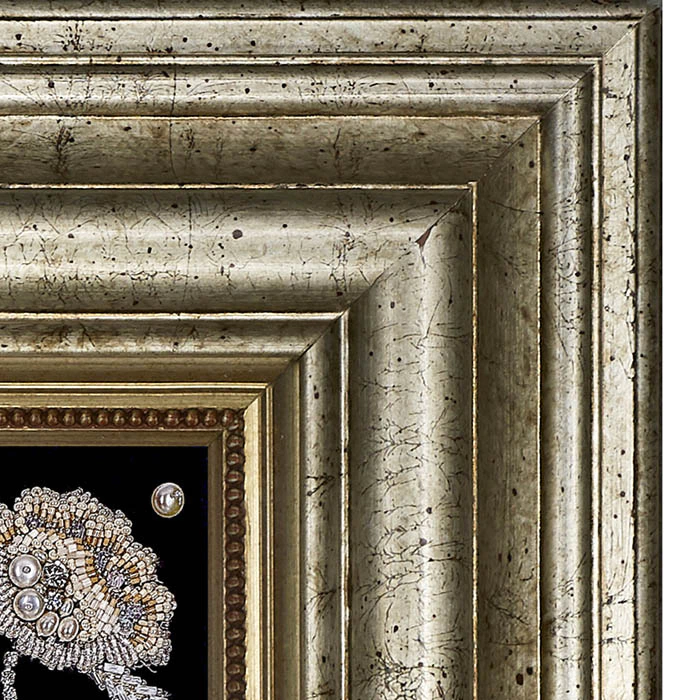 The embroidered icon of St. Nicholas the Wonderworker in a frame