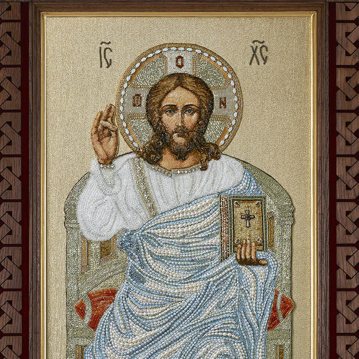 The embroidered icon "The Lord Almighty on the throne" in a frame and a kiosk
