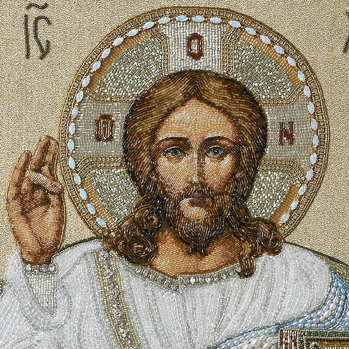 The embroidered icon "The Lord Almighty on the throne" in a frame and a kiosk