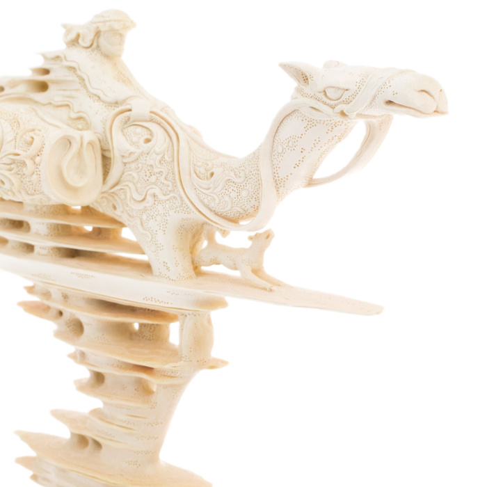 Highly artistic sculpture of a mammoth tusk "Traveller"