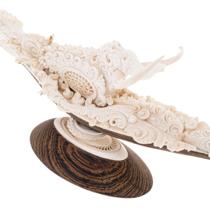 Highly artistic sculpture of a mammoth tusk "Mammoth. The path"