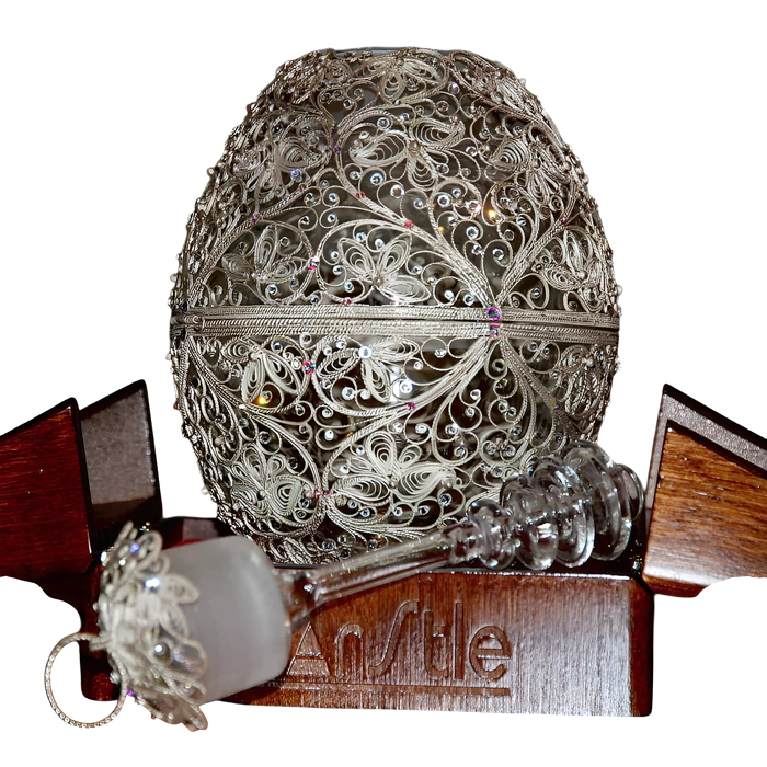 Honeydew egg in a filigree case