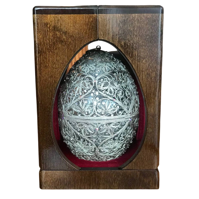 Honeydew egg in a filigree case