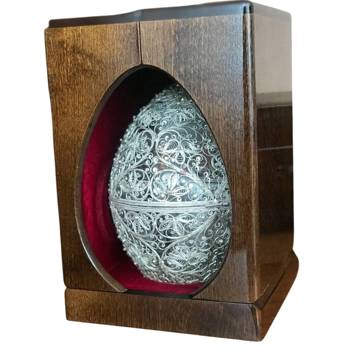 Honeydew egg in a filigree case