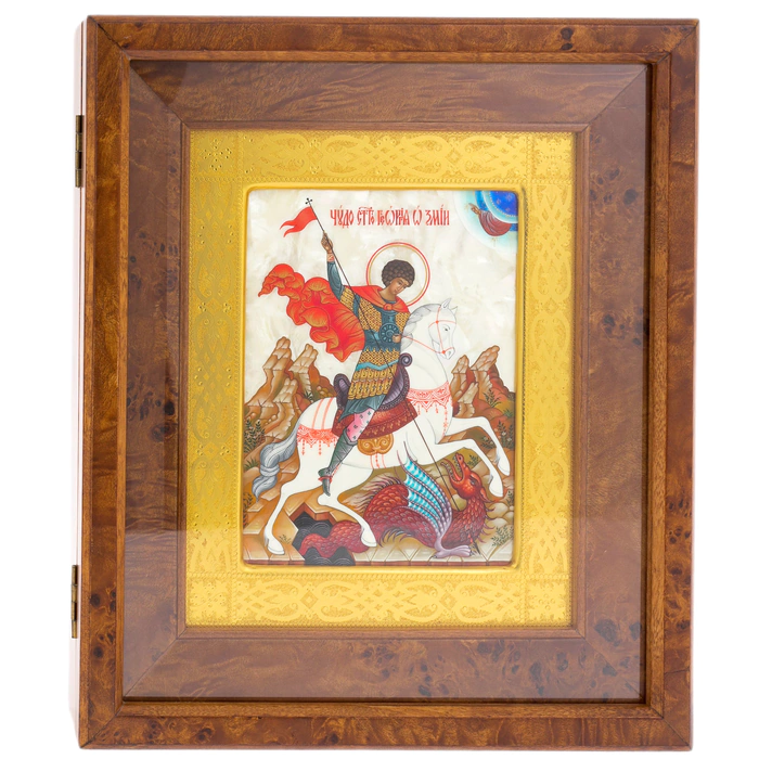 The icon of St. George the Victorious in a kiosk and a gold frame on natural mother-of-pearl