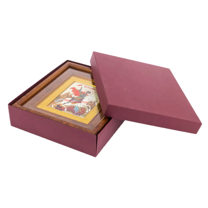 The icon of St. George the Victorious in a kiosk and a gold frame on natural mother-of-pearl