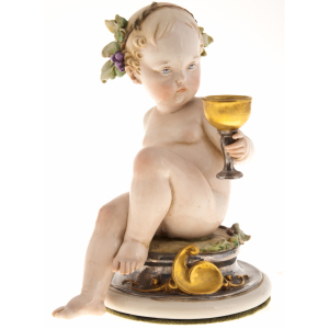 The statuette "Cherub with a glass"