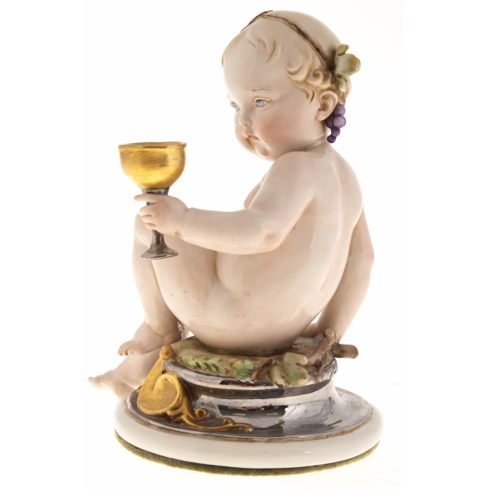 The statuette "Cherub with a glass"