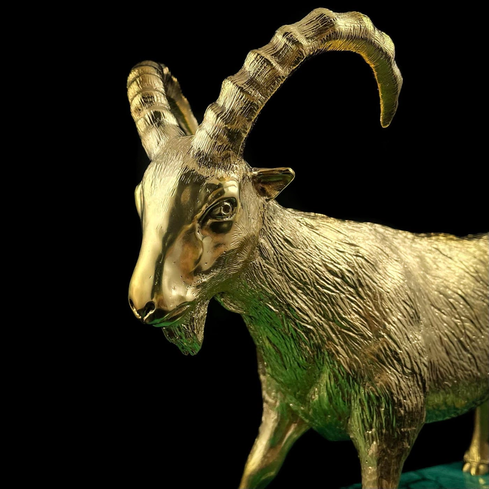 Gilded Golden Capricorn statuette on a malachite stand