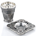 A glass for holy water with a saucer