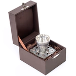 A glass for holy water with a saucer